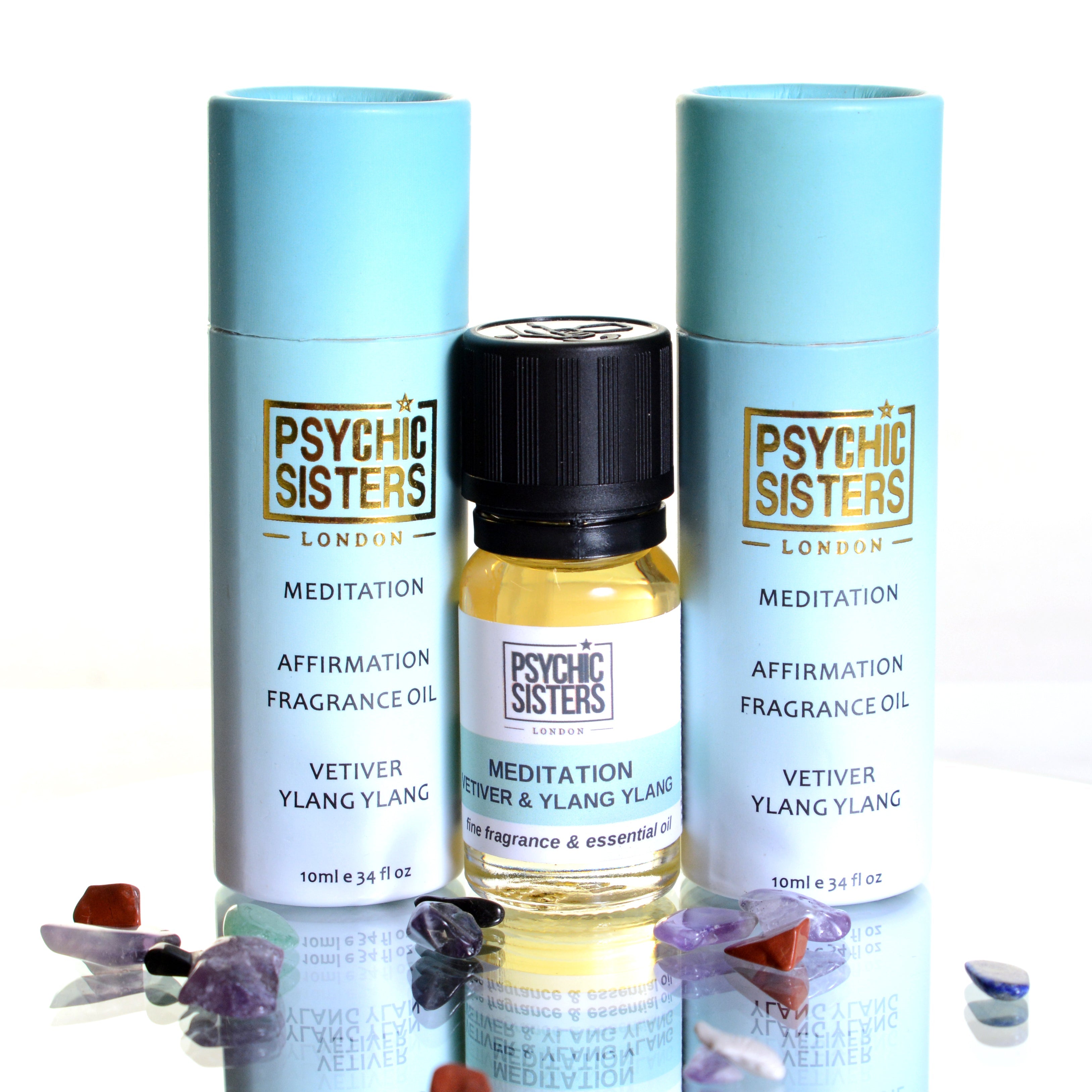 Meditation fragrance oil bottles with vetiver and ylang ylang for relaxation and energy balancing.